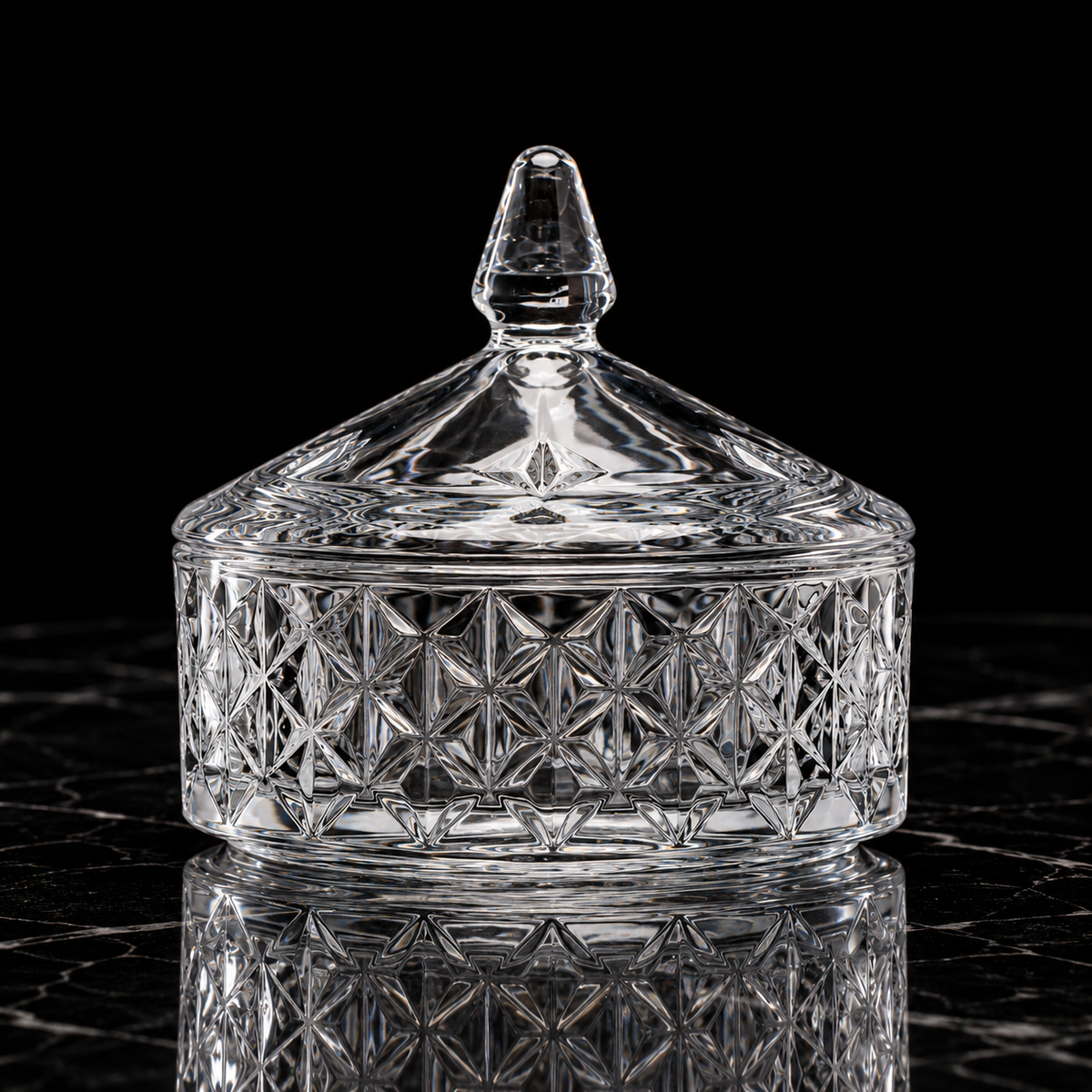 Crystal round candy box with lid on black marble
