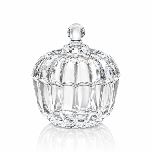 Pinwheel cut crystal candy bowl with lid on ball feet on white