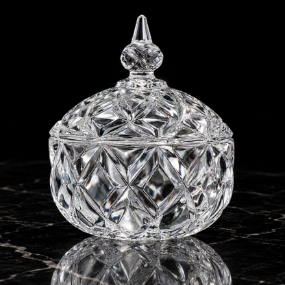 Crystal star-cut candy jar with lid on black marble