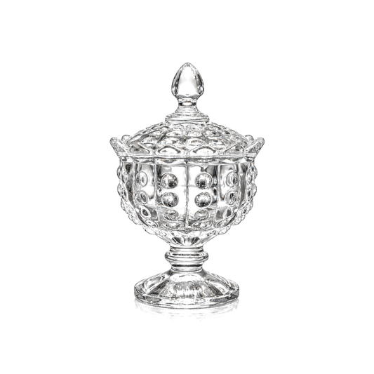 Thumbprint glass sugar bowl with lid on pedestal on white
