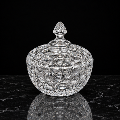 Large bubble glass candy bowl on black marble
