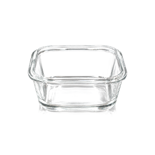 Small square clear glass dish on white