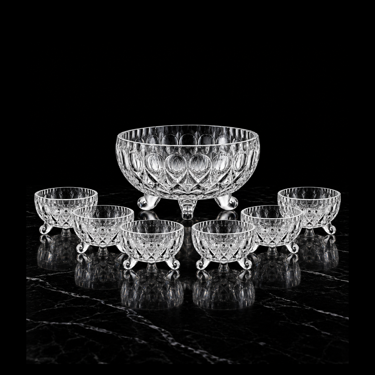 Teardrop-cut glass bowl set on black marble