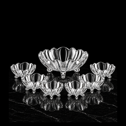 Wavy-rim glass bowl set on black marble