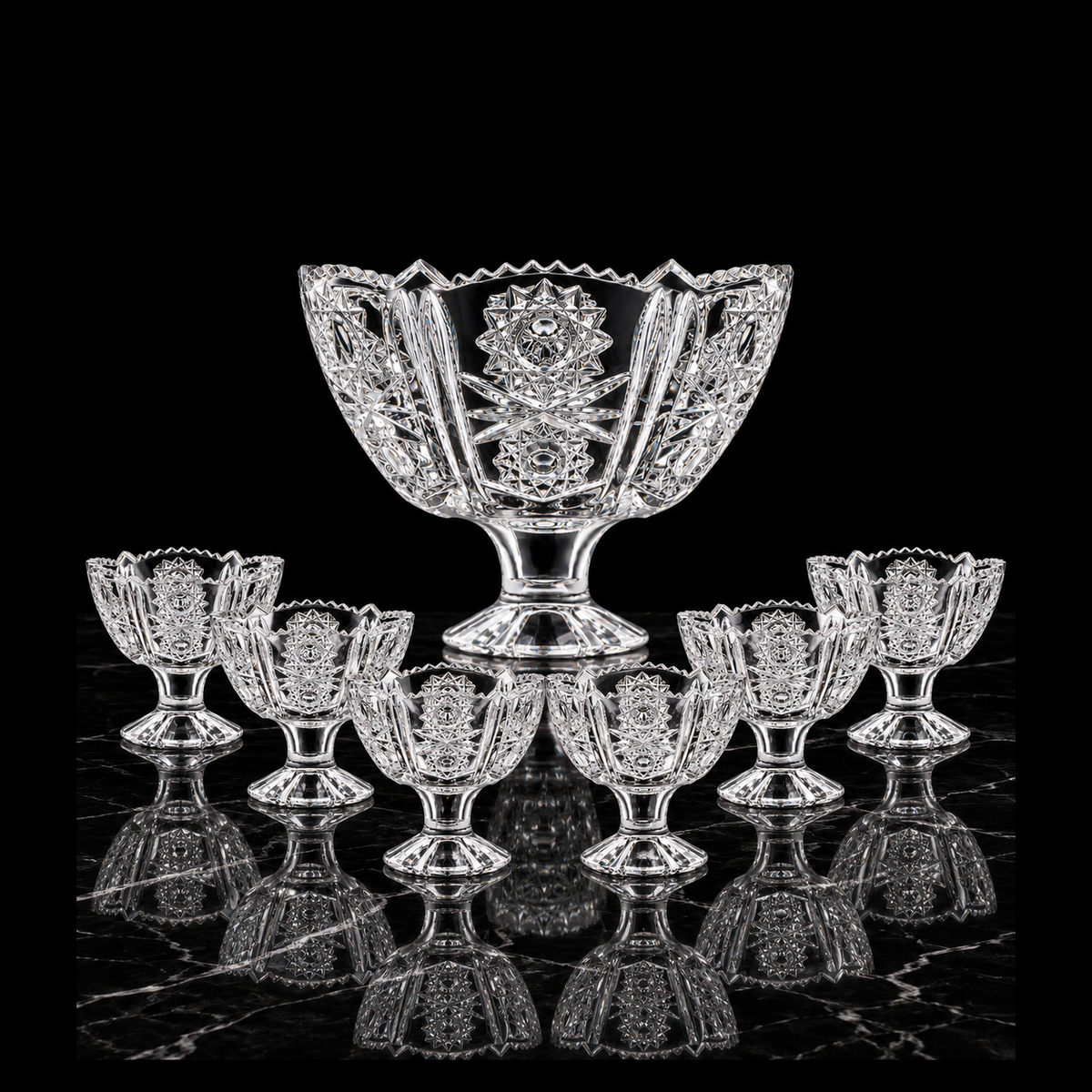 Starburst-cut crystal footed set on black marble