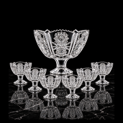 Starburst-cut crystal footed set on black marble