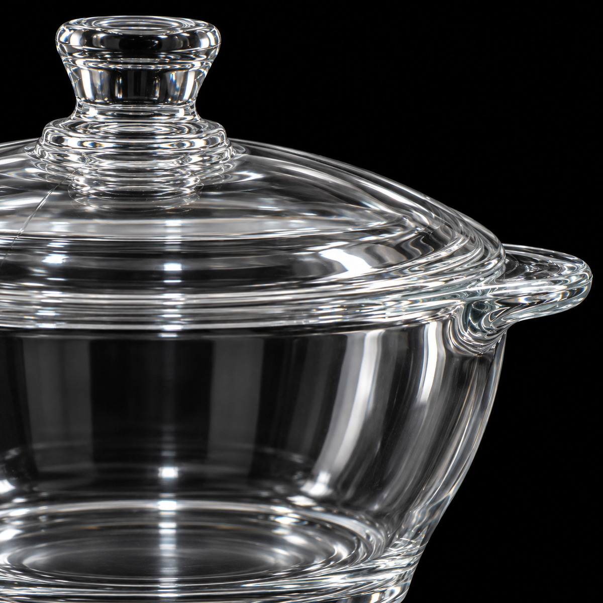 Close-up of glass casserole lid knob and handle