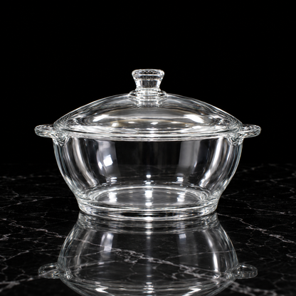 Glass casserole with lid on black marble