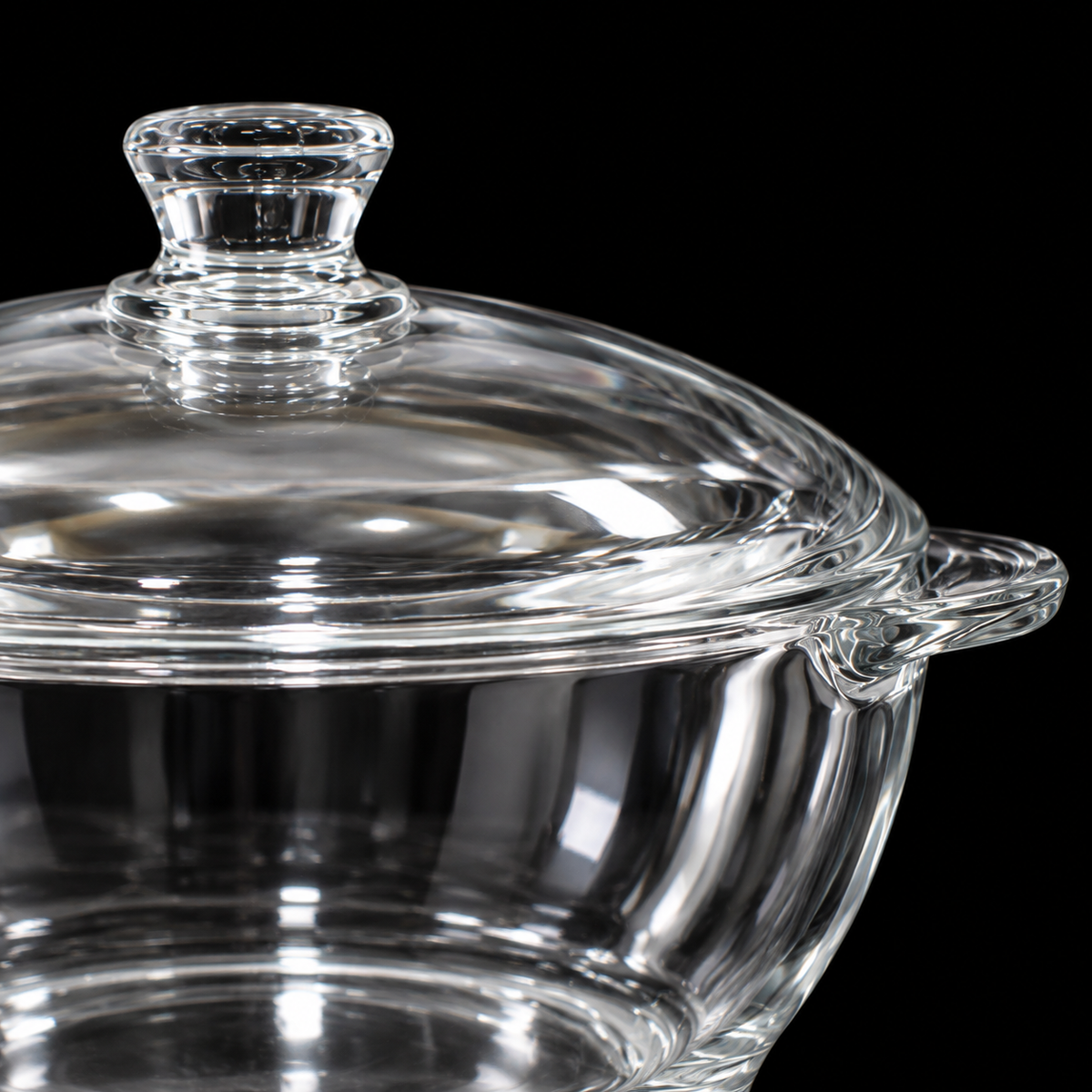 Close-up of glass casserole lid knob and handle