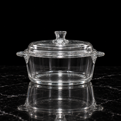 Glass casserole with lid on black marble