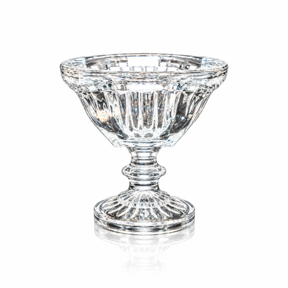 Fluted crystal footed bowl with square rim on white marble