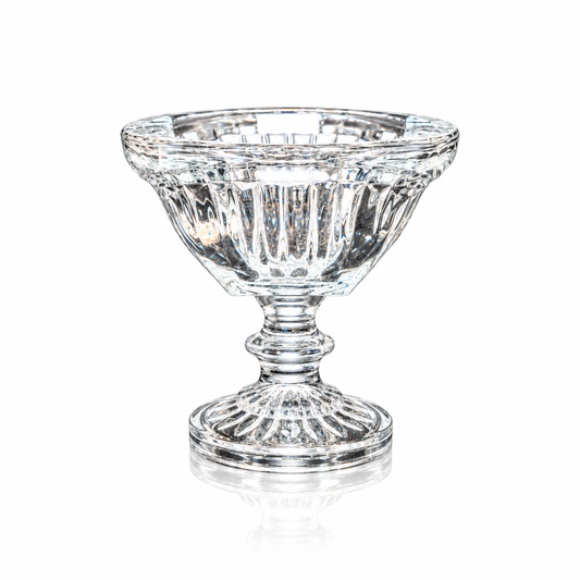 Fluted crystal footed bowl with square rim on white marble