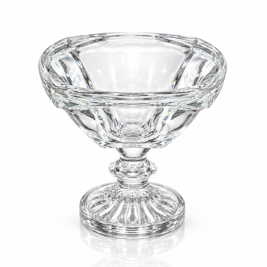 Footed crystal glass serving bowl on white marble