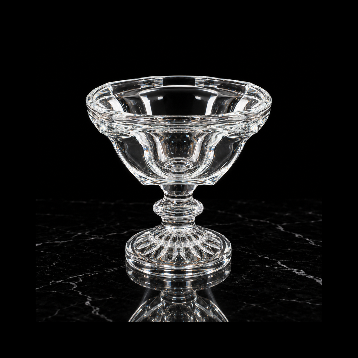 Footed crystal bowl on black marble