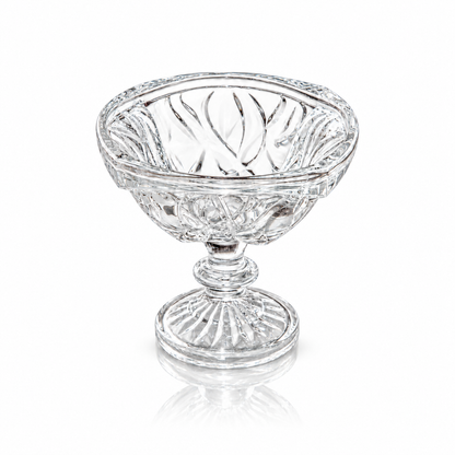 Swirl-cut footed crystal serving bowl on white marble