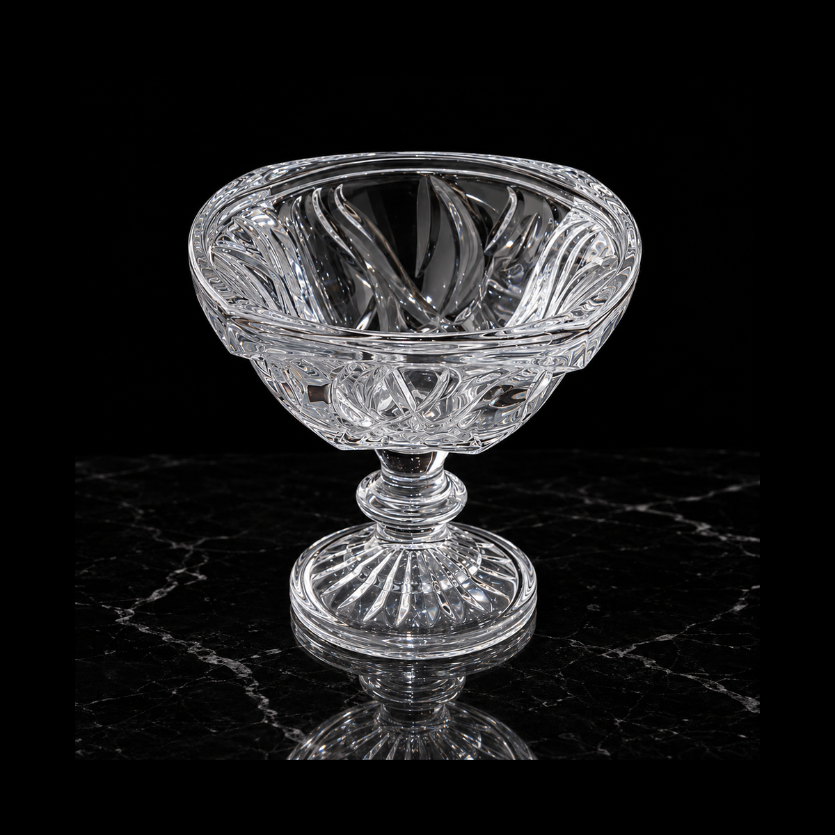 Swirl-cut crystal bowl on black marble