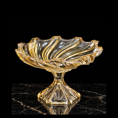 Gold swirl crystal fruit bowl on black marble