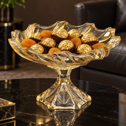 Gold crystal bowl with chocolates and dried apricots