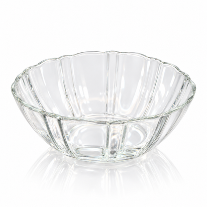 Fluted clear glass bowl with scalloped rim on white