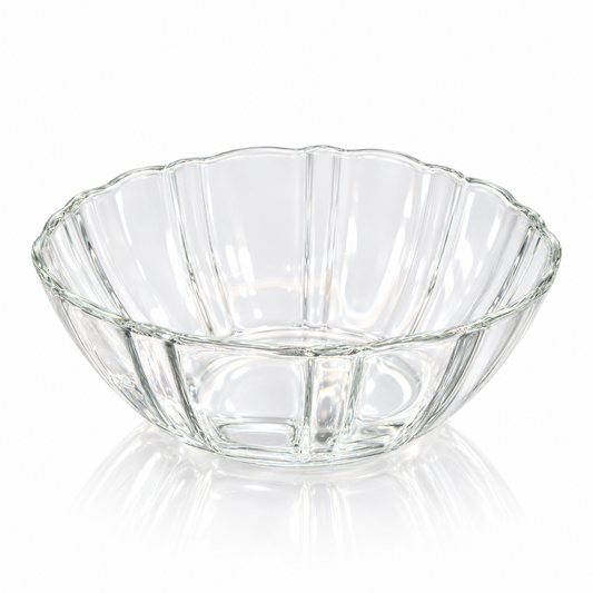 Fluted clear glass bowl with scalloped rim on white