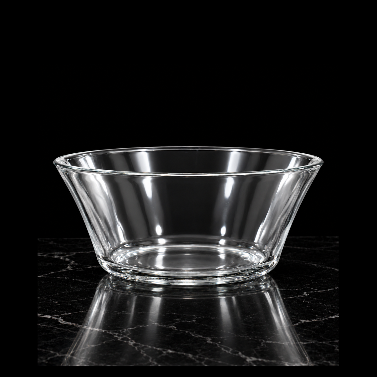 Clear glass bowl on black marble