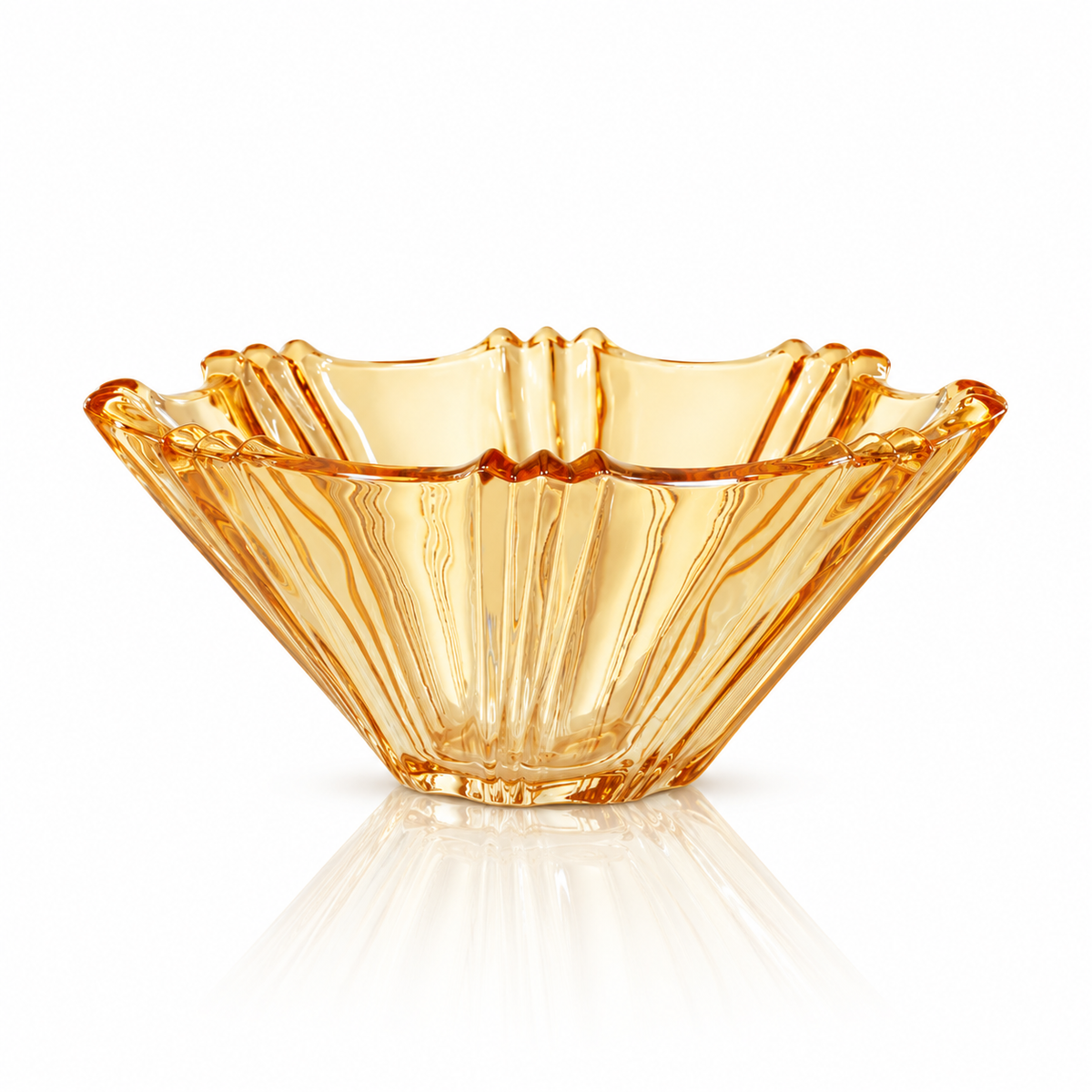 Amber glass fruit bowl with wavy rim on white marble