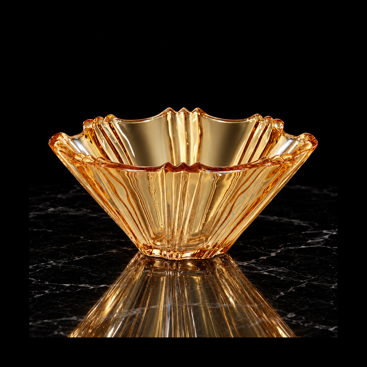 Amber glass fruit bowl on black marble