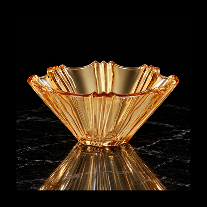 Amber glass fruit bowl on black marble