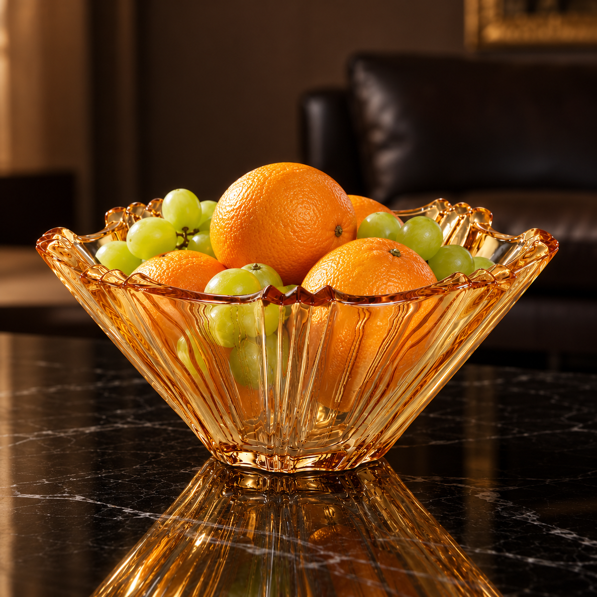 Amber fruit bowl with oranges and grapes in a living room