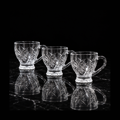 Glass tea cups on black marble