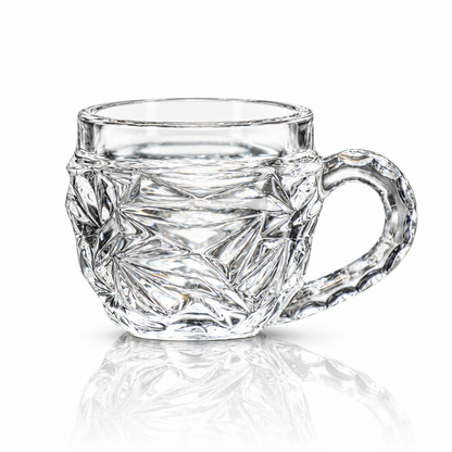 Set of 6 starburst-cut glass tea cups with handles on white marble