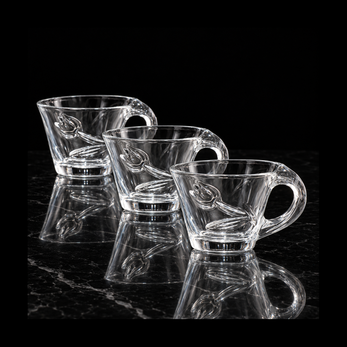 Tulip glass tea cups on black marble