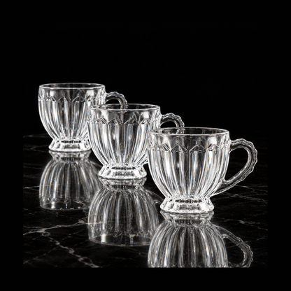 Ribbed glass tea cups on black marble