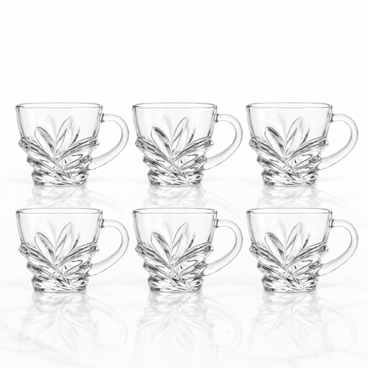 Set of 6 leaf-cut glass tea cups with handles on white marble