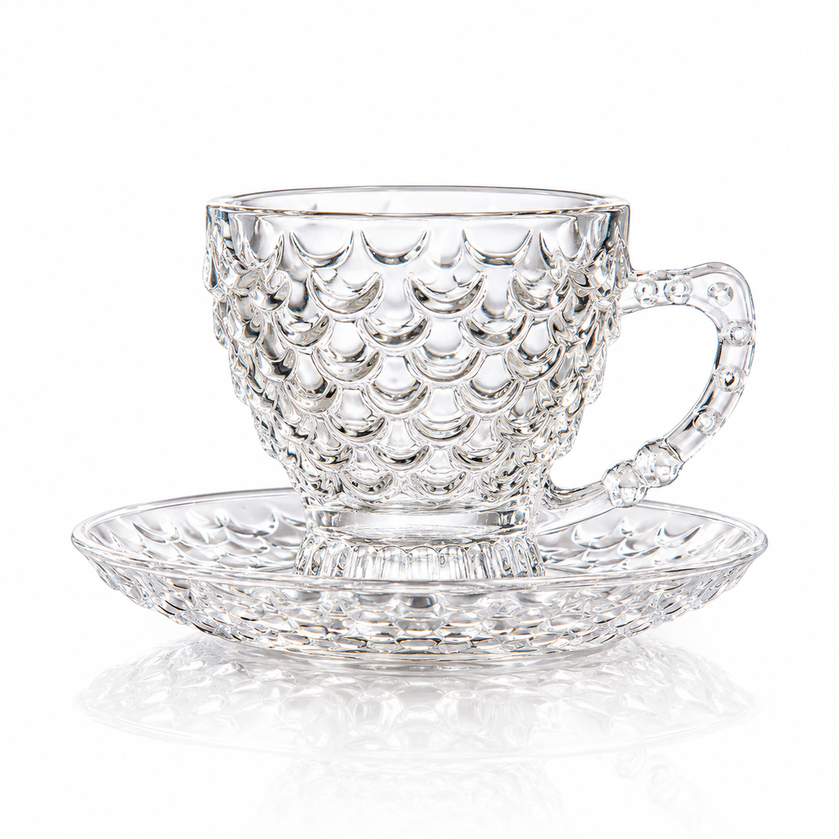 Fish scale glass tea cup and saucer on white