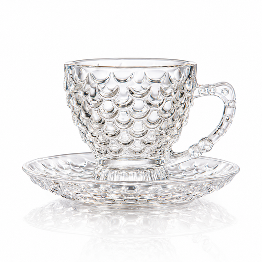 Fish scale glass tea cup and saucer on white