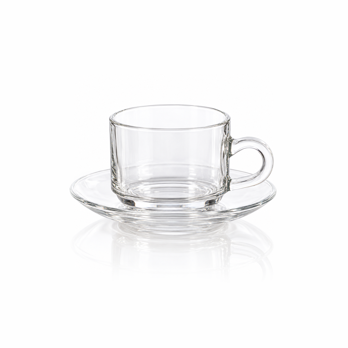 Clear glass tea cup and saucer on white