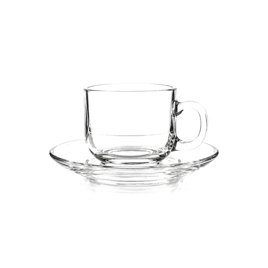 Clear glass tea cup and saucer on white