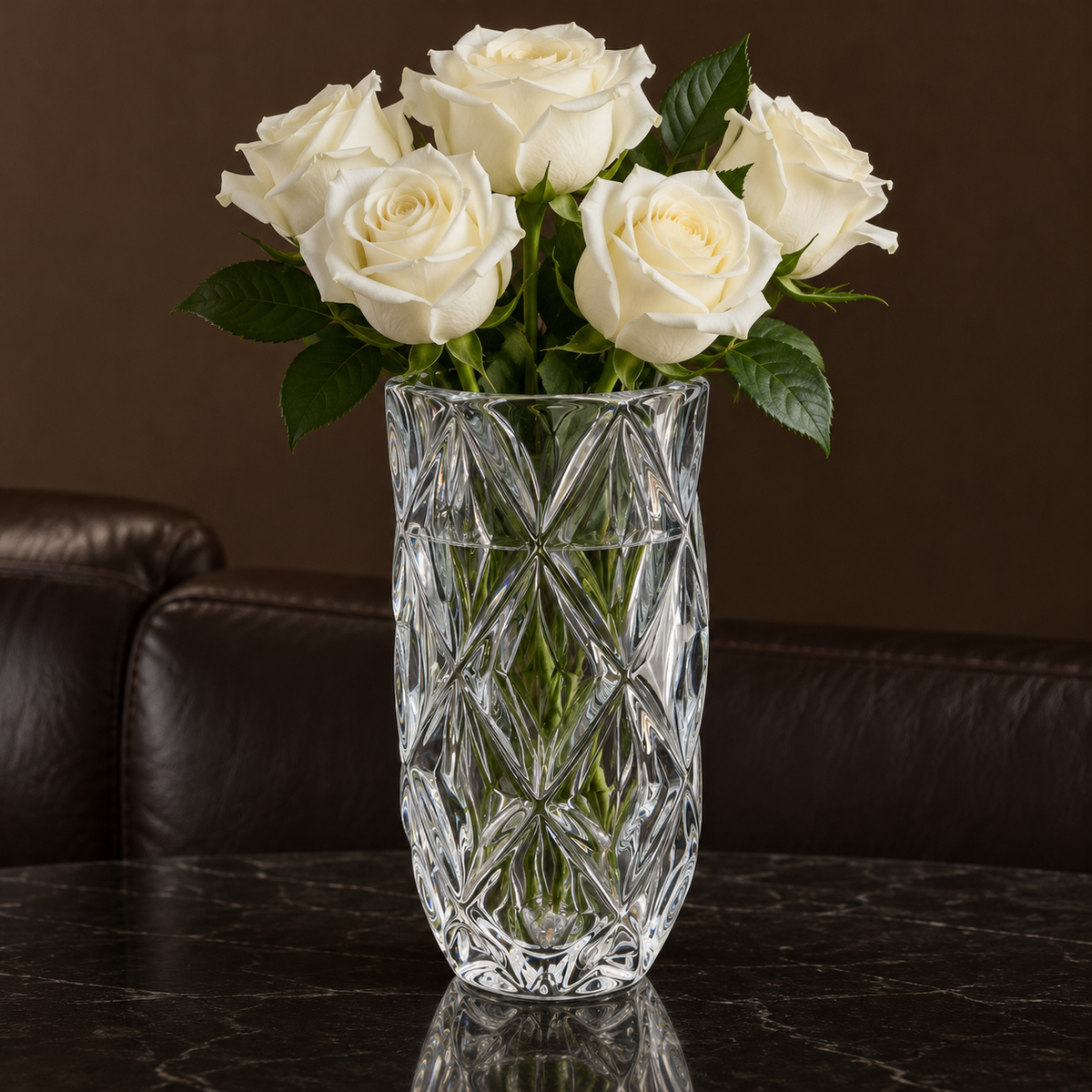 Crystal vase with white roses in a living room