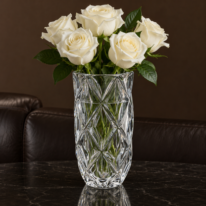 Crystal vase with white roses in a living room