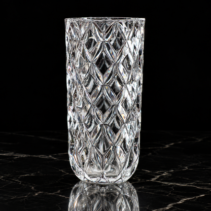 Crystal diamond-cut flower vase on black marble