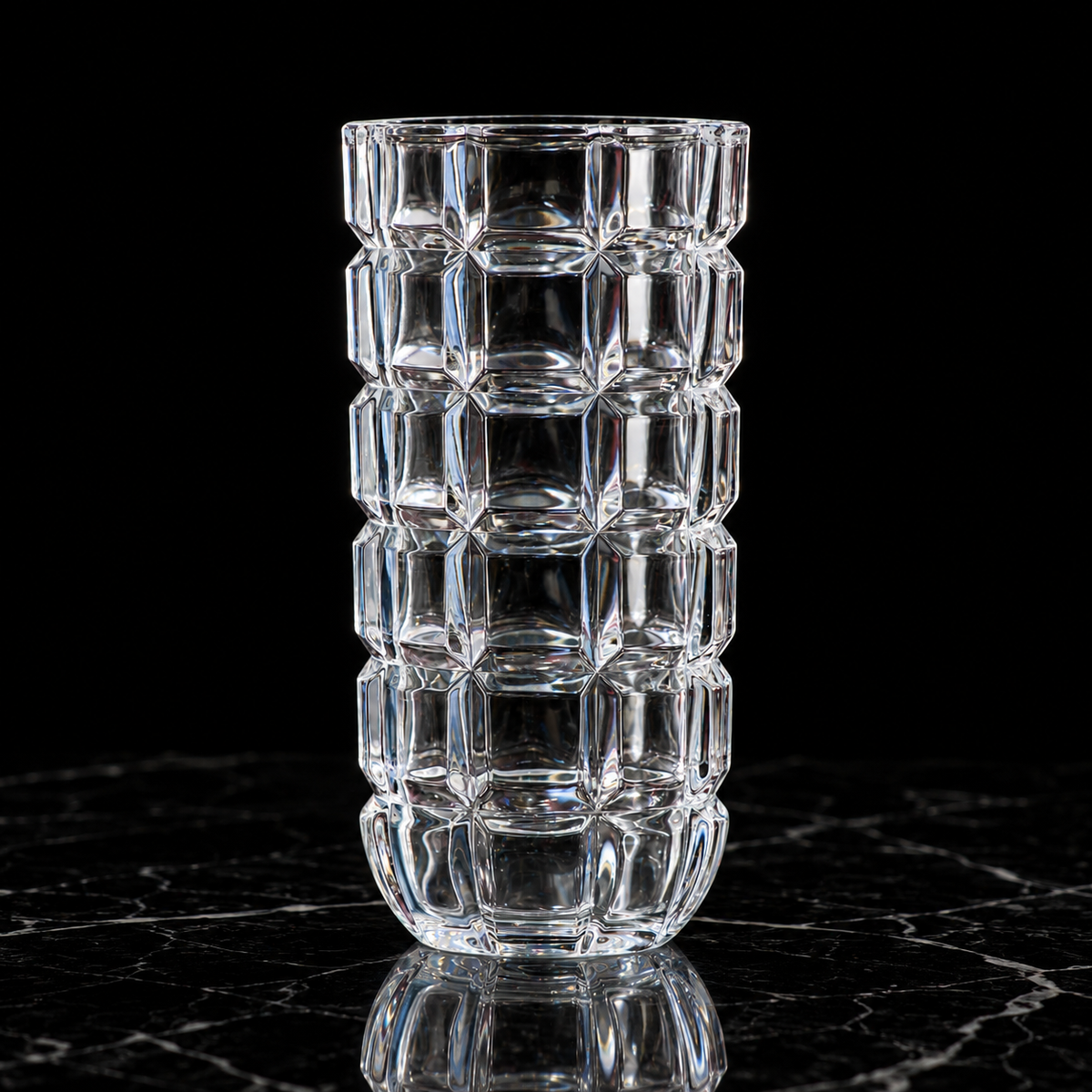 Crystal block-cut flower vase on black marble