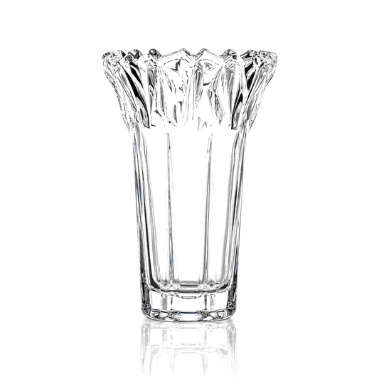 Crystal flower vase with jagged crown rim on white marble