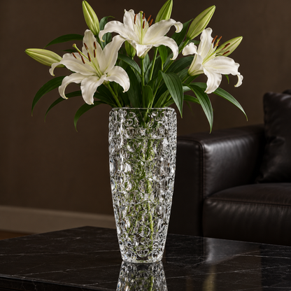 Crystal vase with white lilies in a living room