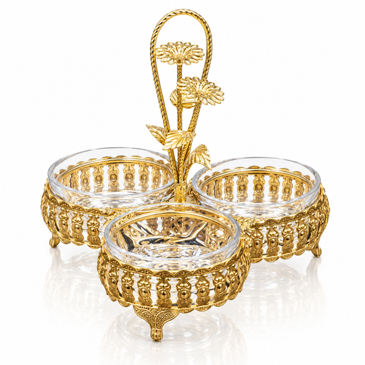 Gold filigree triple serving dish with flower handle on white