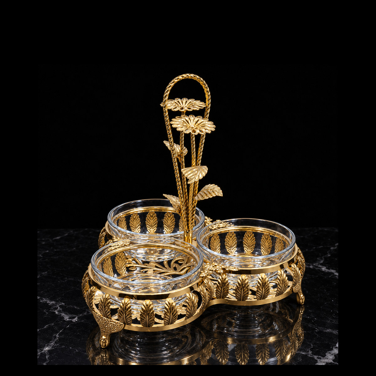 Gold triple serving dish on black marble
