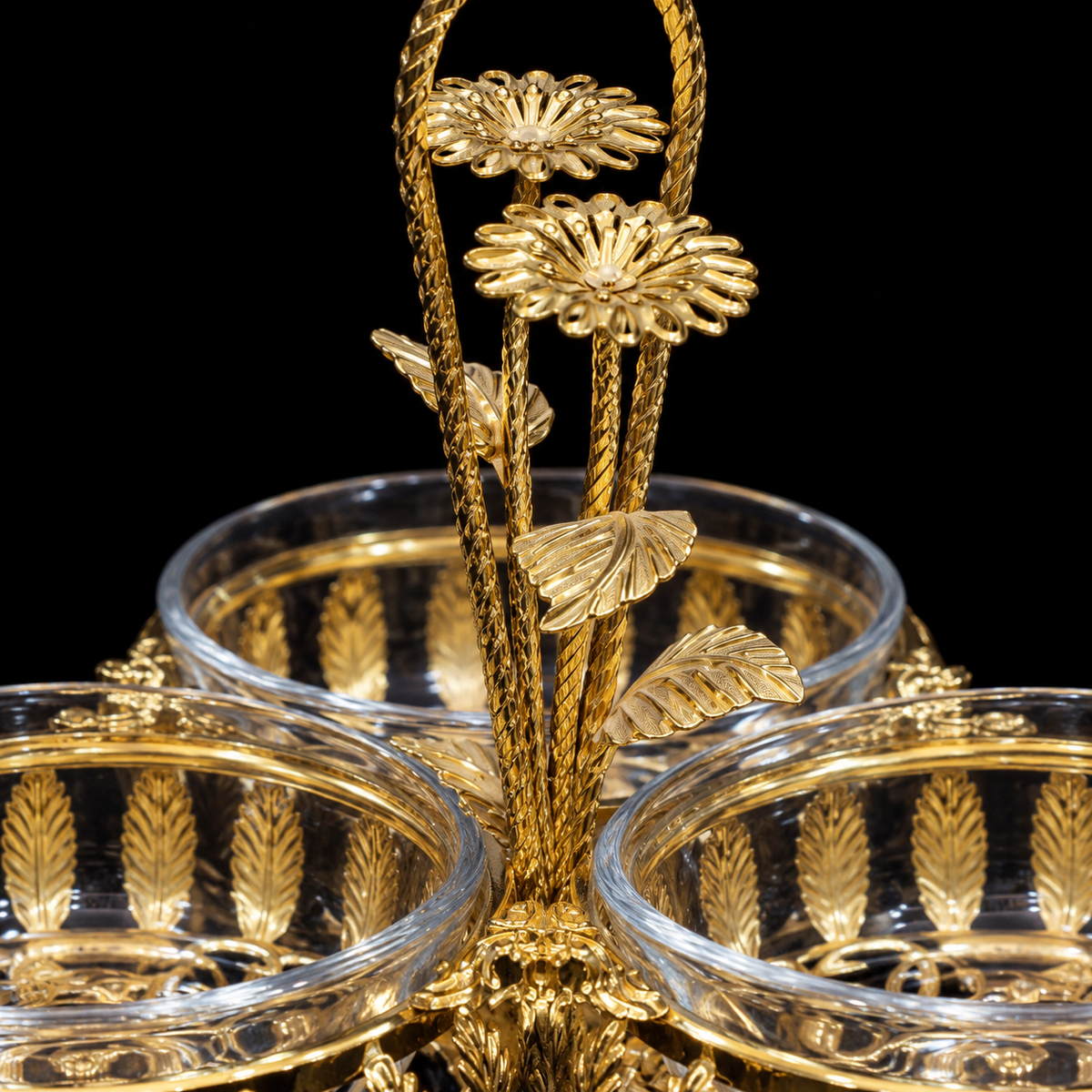 Close-up of the gold daisy handle and leaf filigree