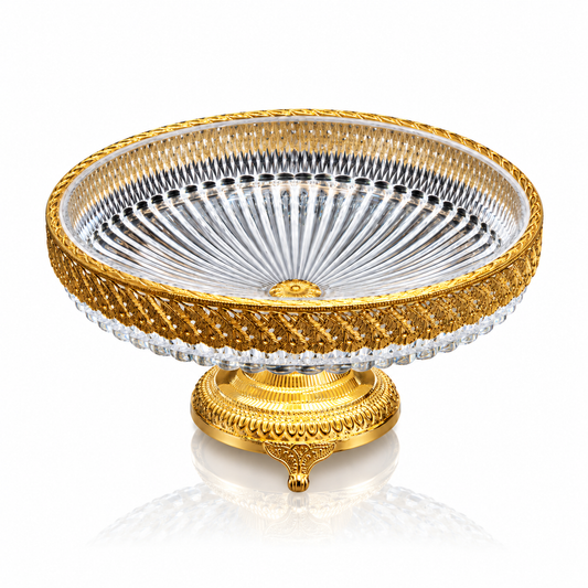 Cut crystal fruit bowl with gold lattice band on gold pedestal on white