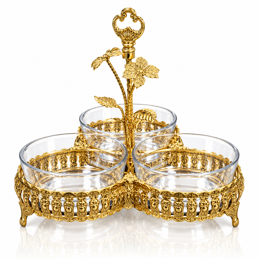 Gold filigree triple serving dish with key finial handle on white