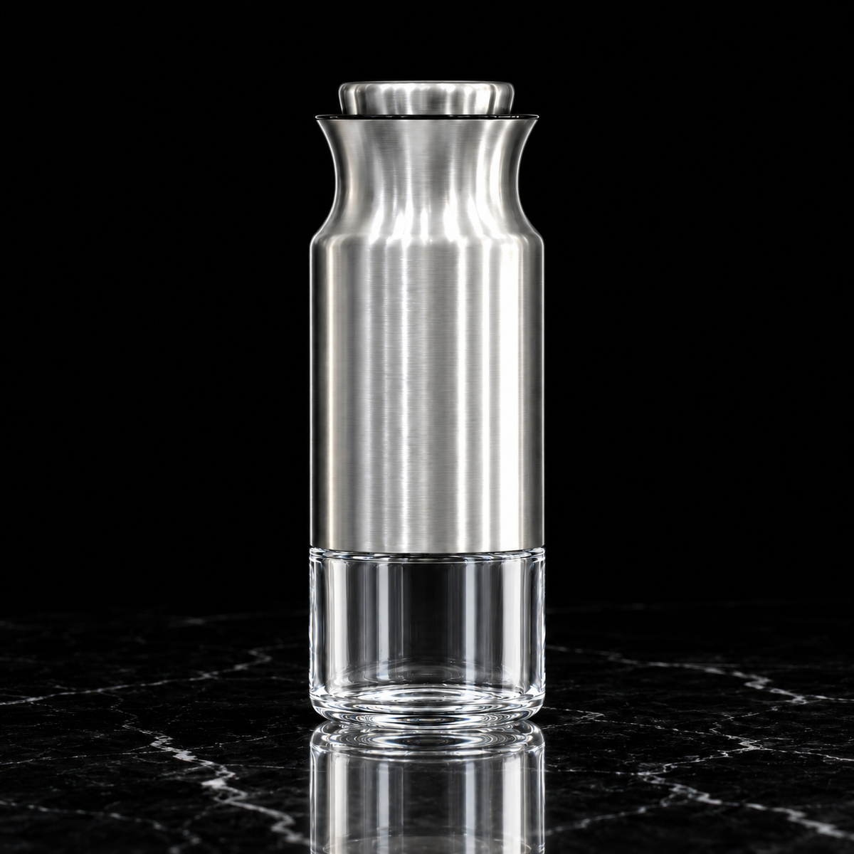 Steel and glass storage jar on black marble